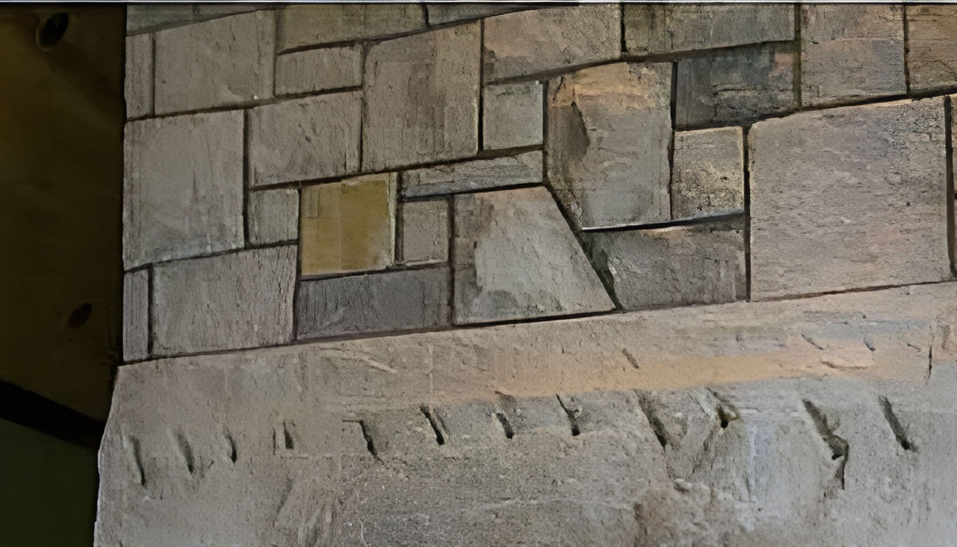 Close texture of hand-faced stone coursing